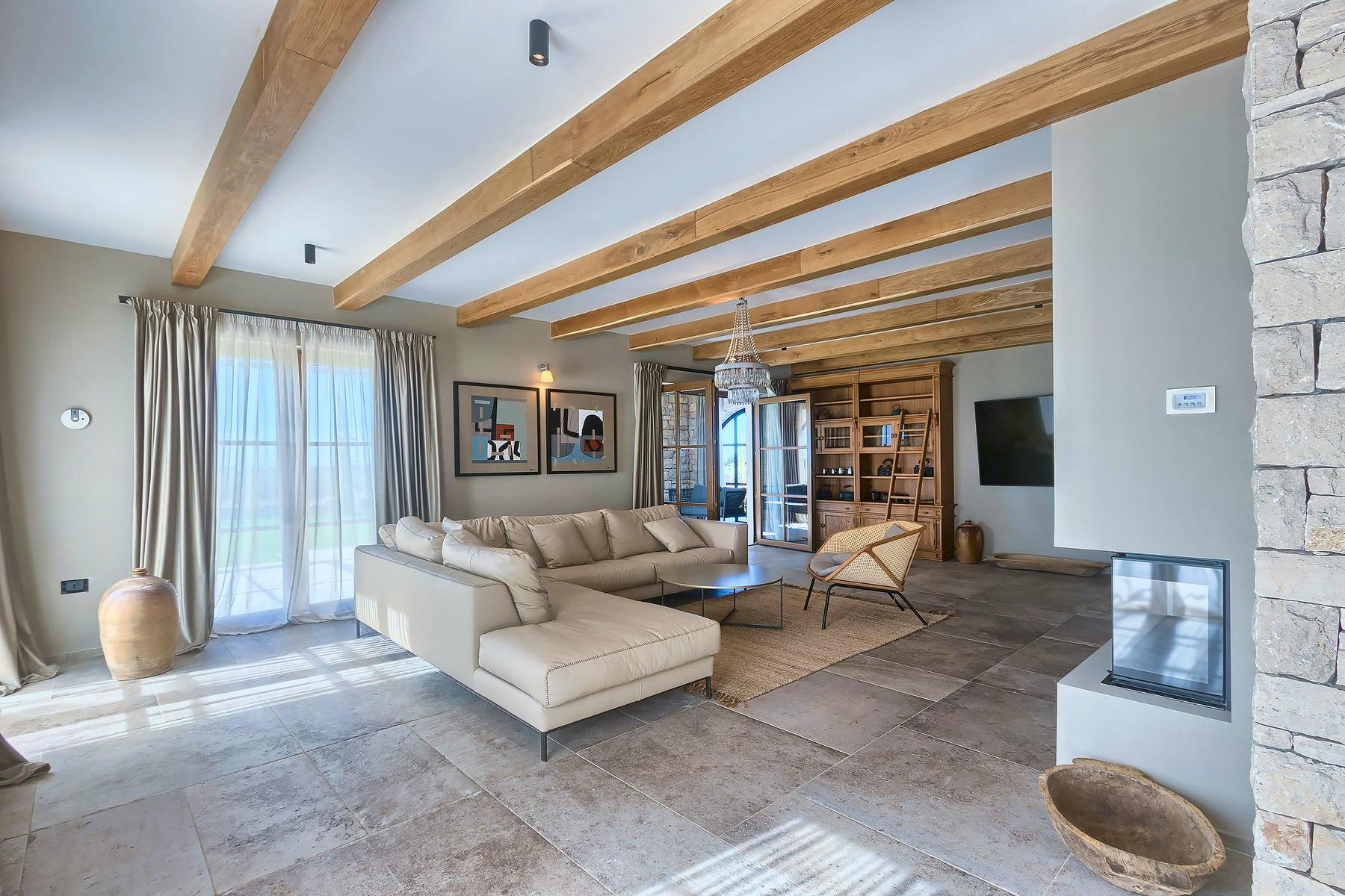 Cozy living room area enhanced by wooden beams