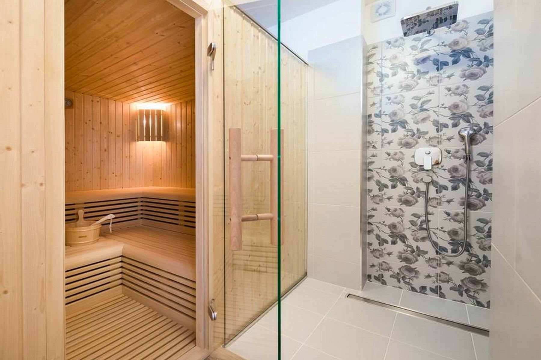 Spa area with a sauna and walk-in shower