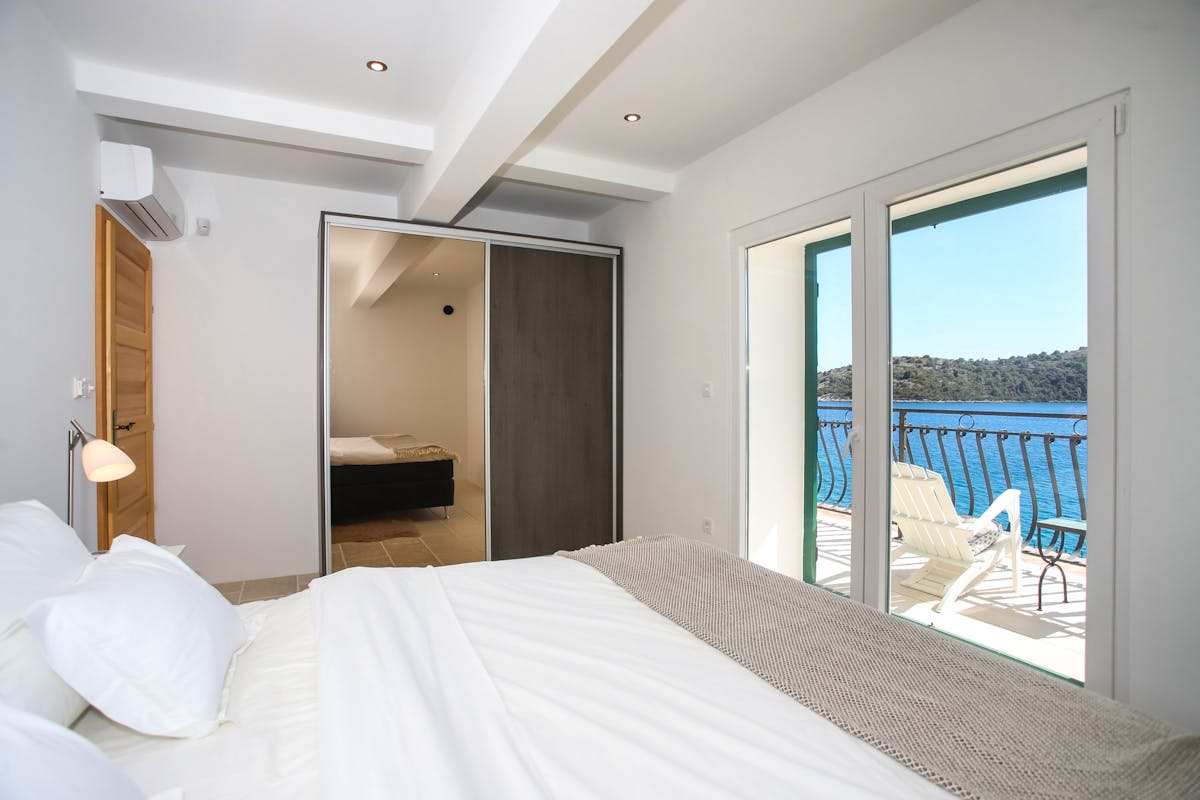 En suite bedroom with stunning sea view