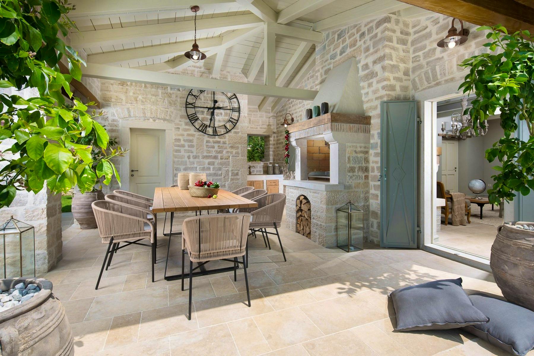Outside dining area with stone barbecue