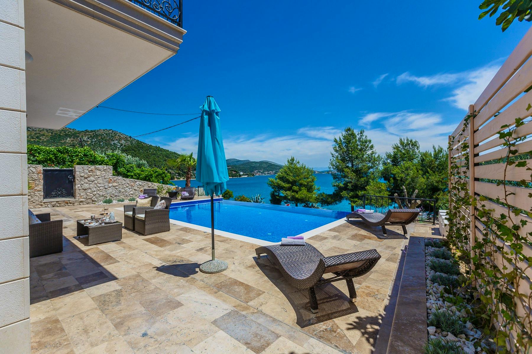Spacious terrace with pool, sundeck and lounge area
