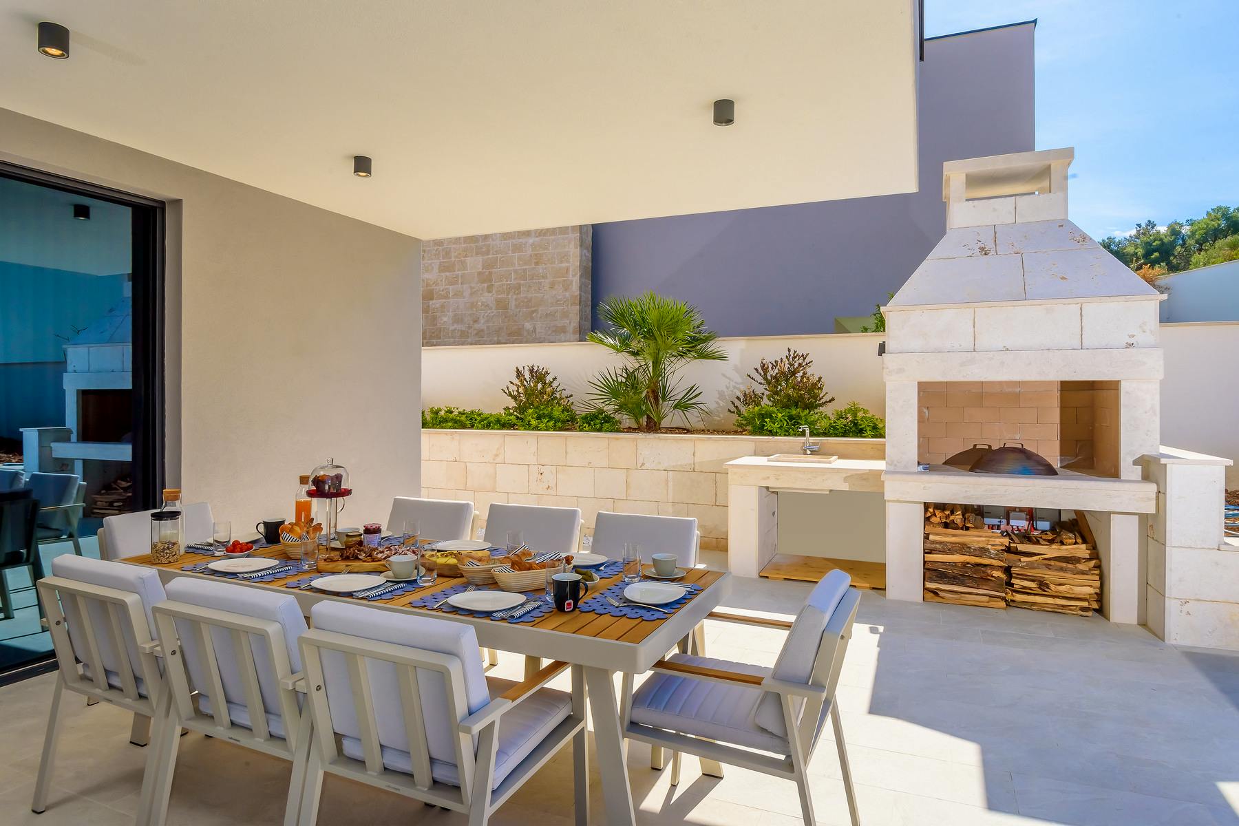Outdoor dining area with stone grill 