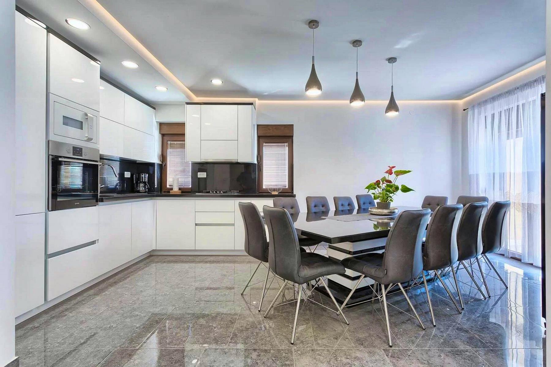 Fully fitted modern kitchen with dining area