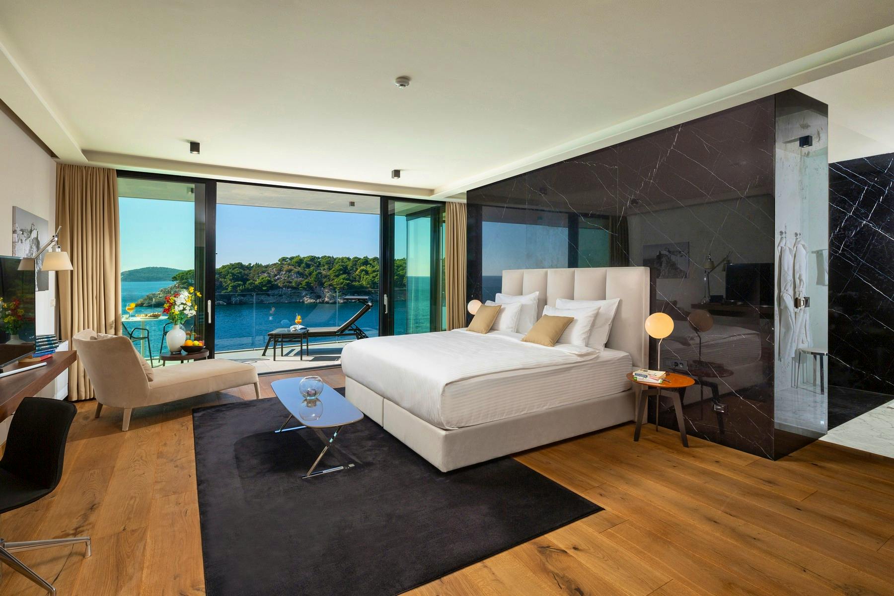 Modern double bedroom boasting open sea view  