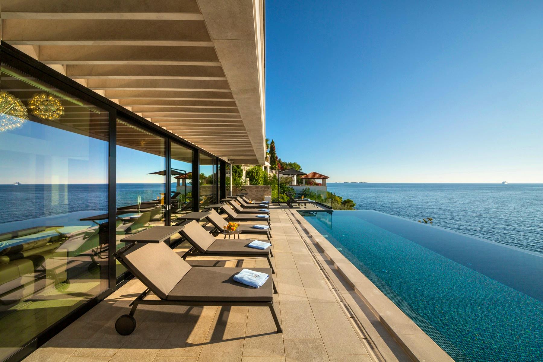 Infinity pool with sunbathing terrace