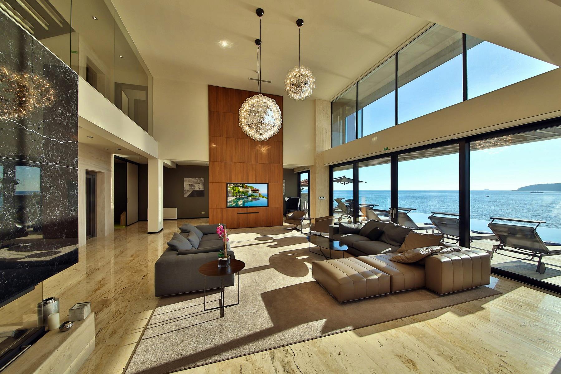Contemporary living room boasting sea view