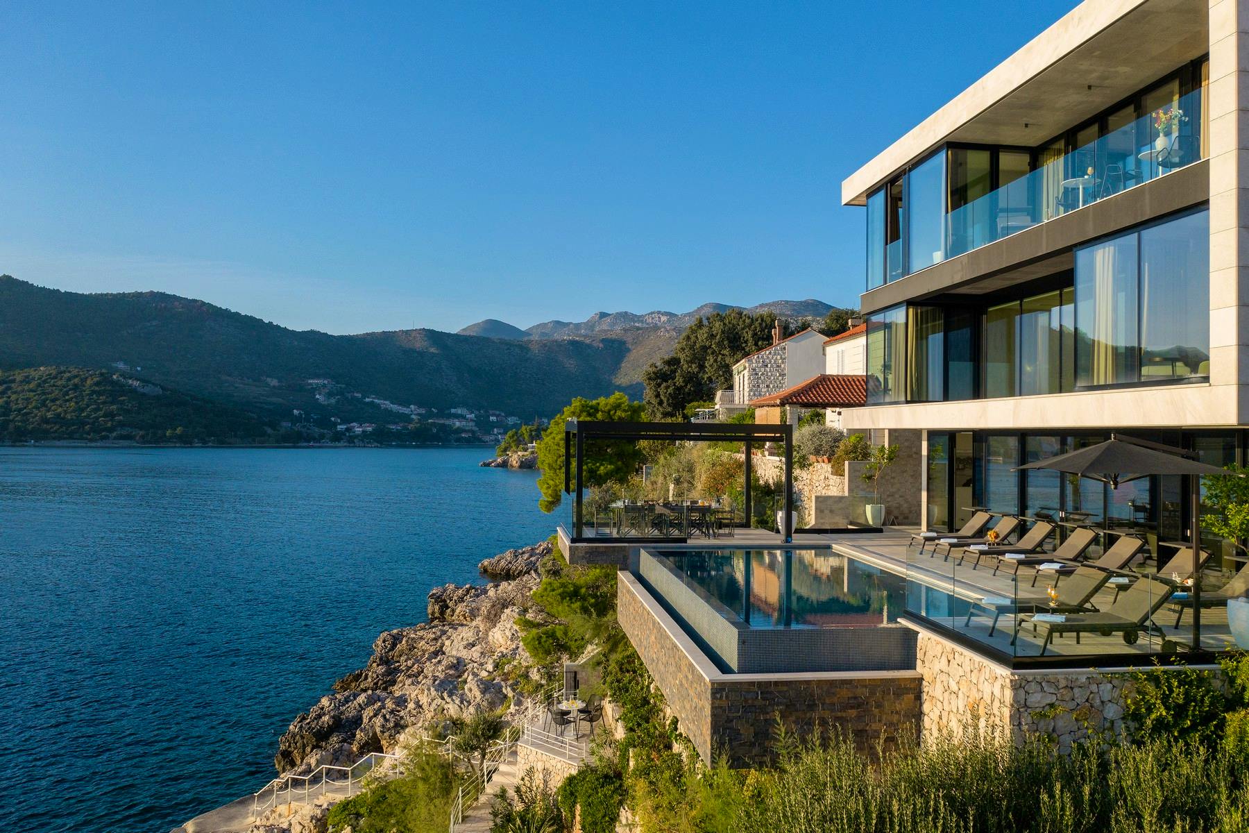 Modern villa hidden between rocky cliffs