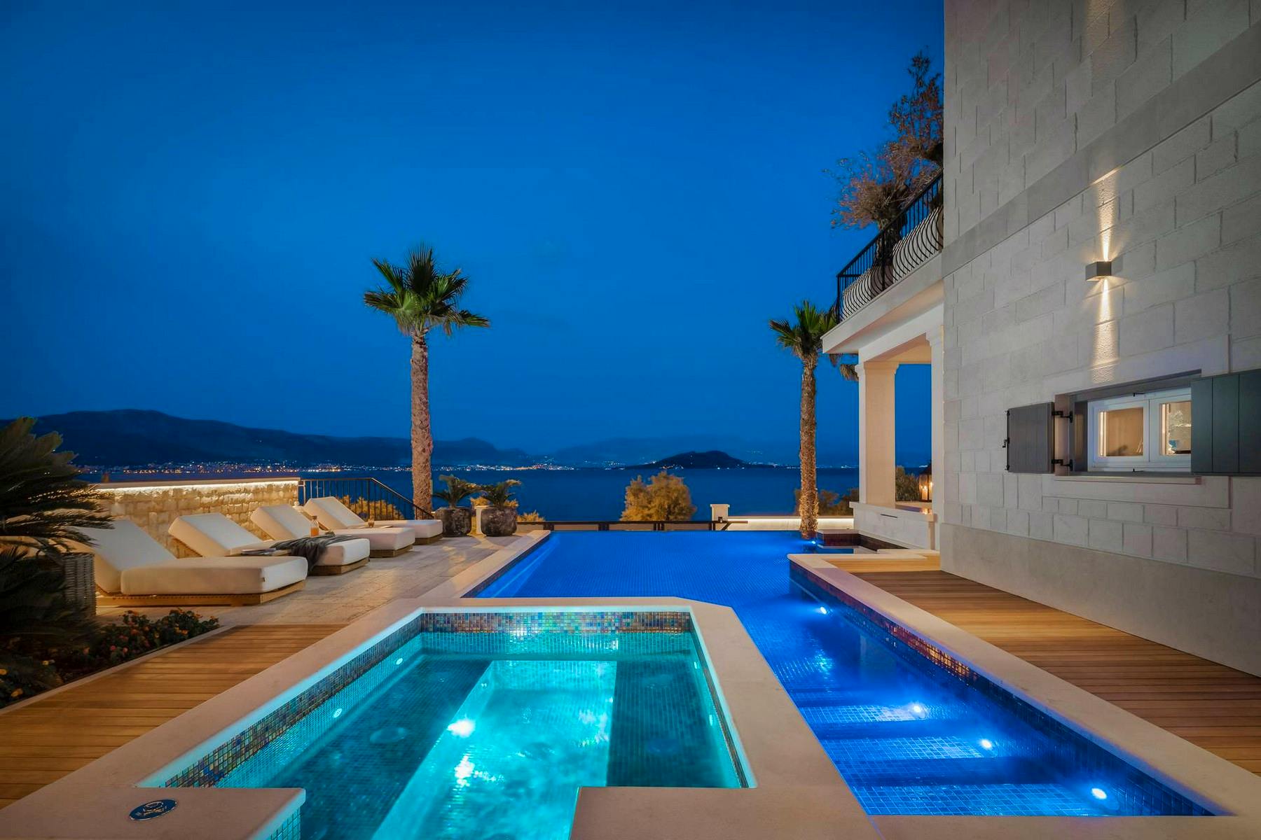 Swimming pool and hot tub with night lighting