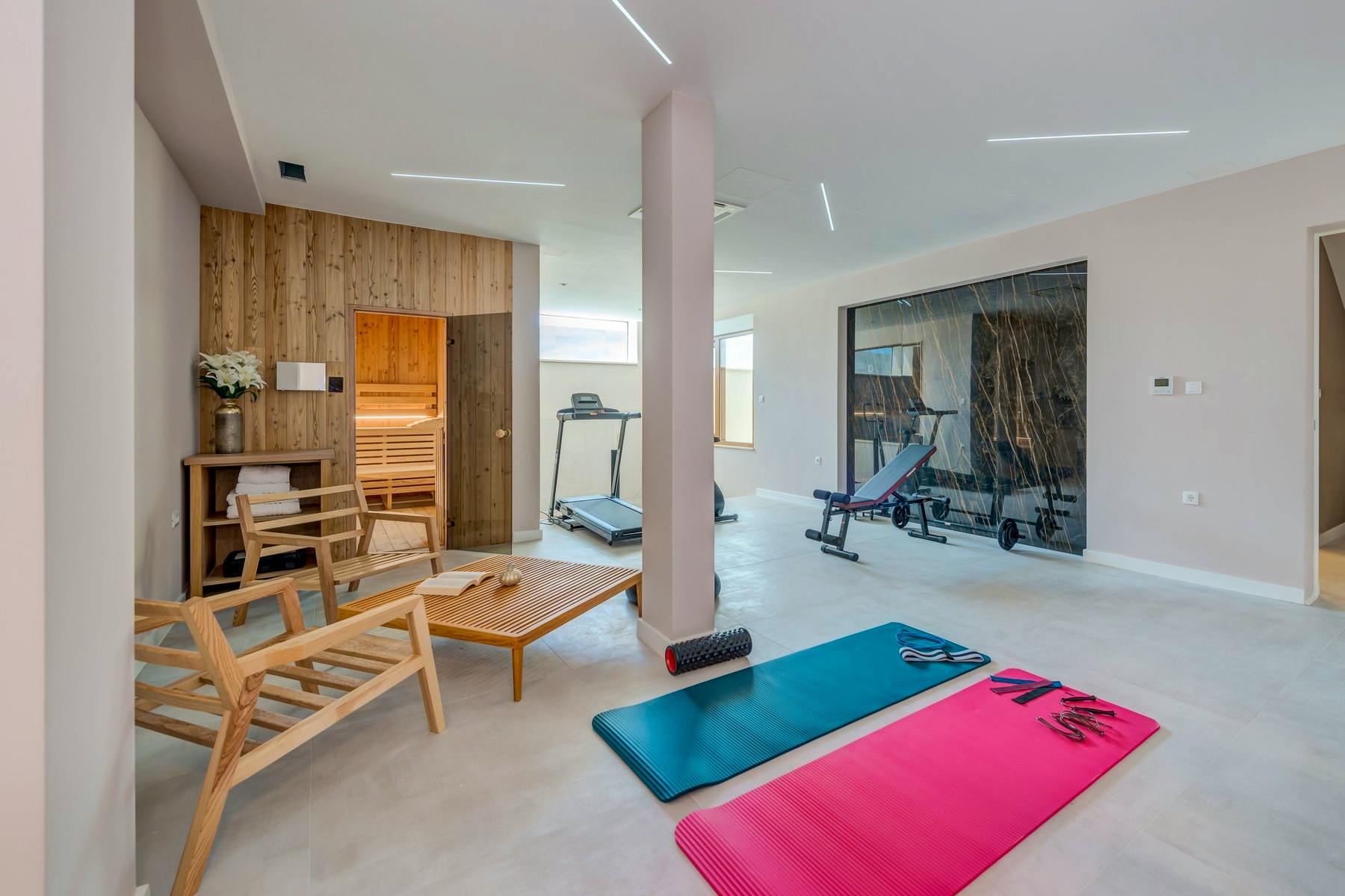 Spa zone with fitness equipment and sauna