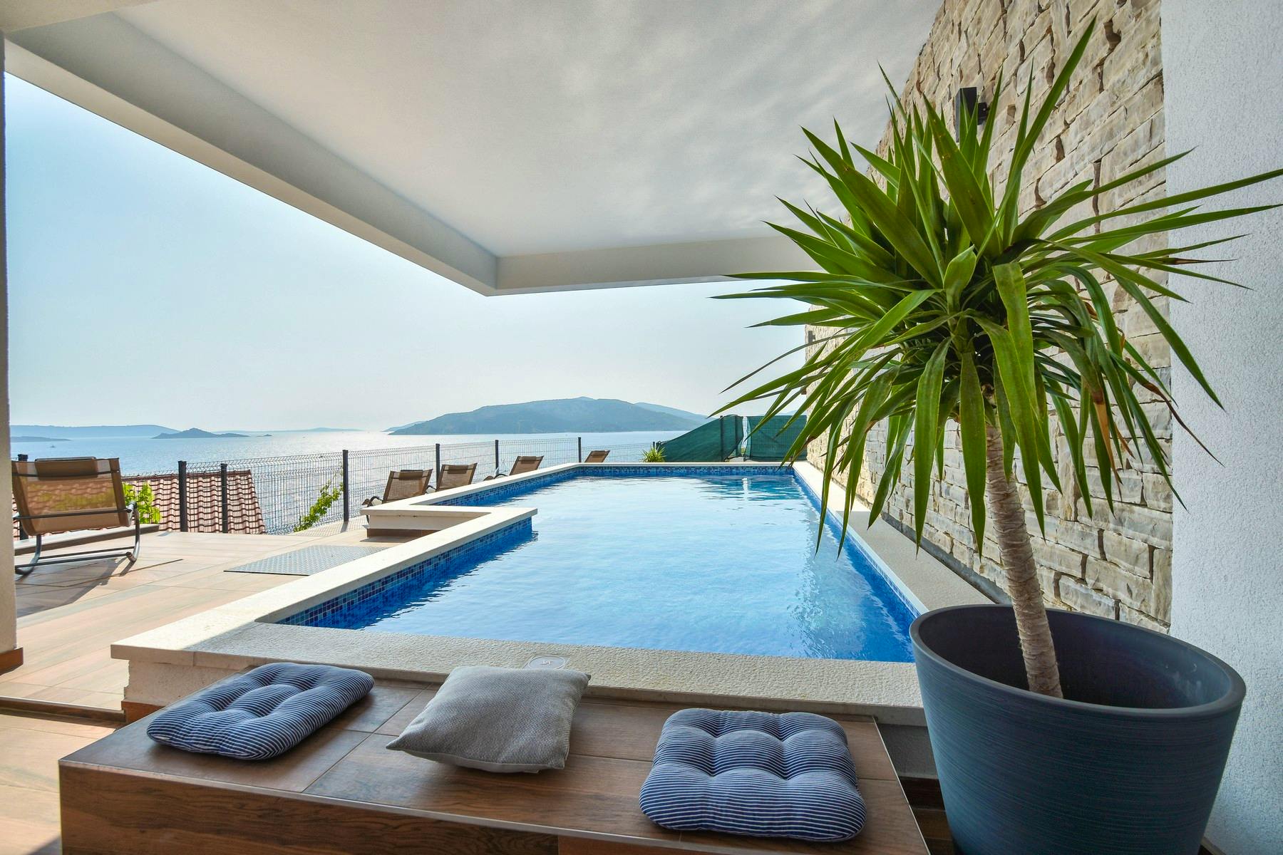 Modern pool area boasting sea view