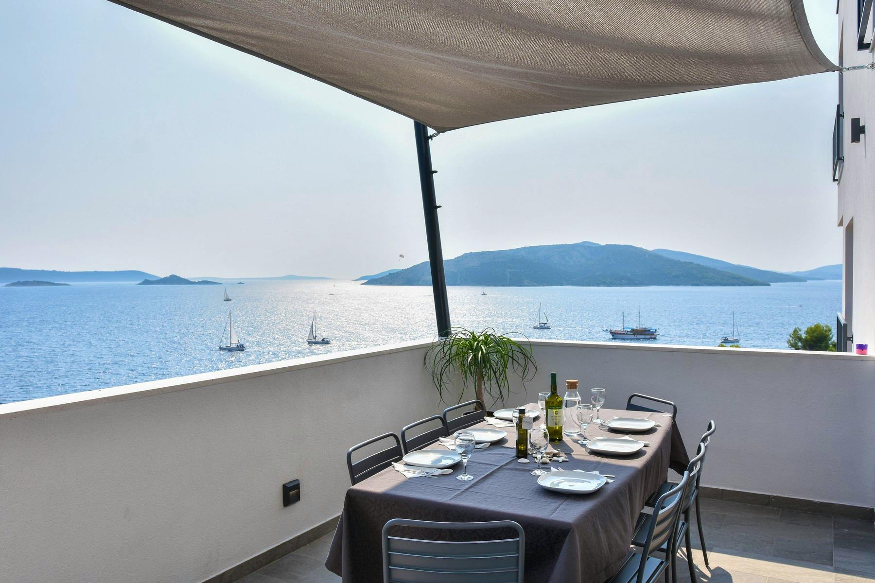 Outdoor dining area offering picturesque sea view