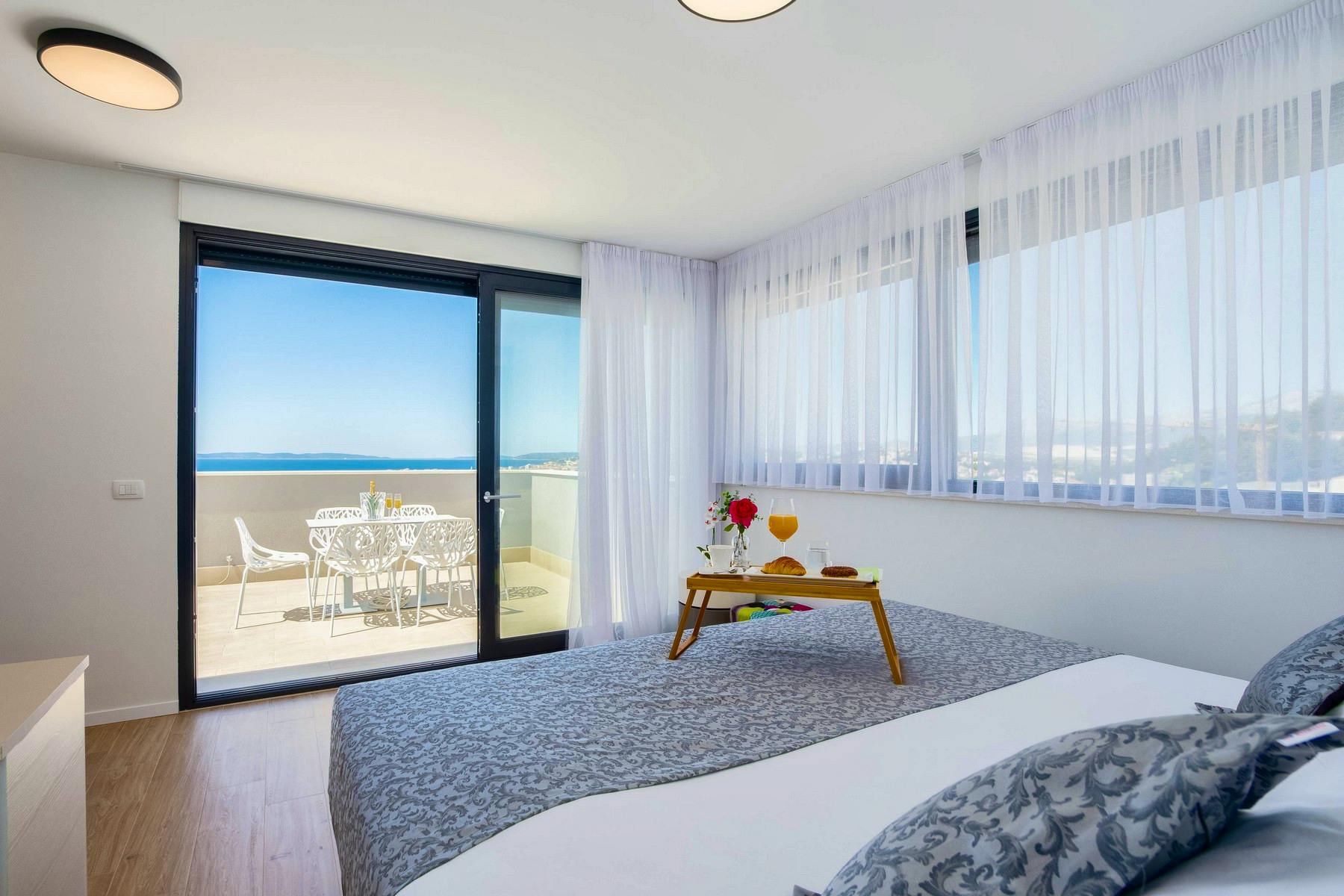 Ensuite bedroom with open sea view