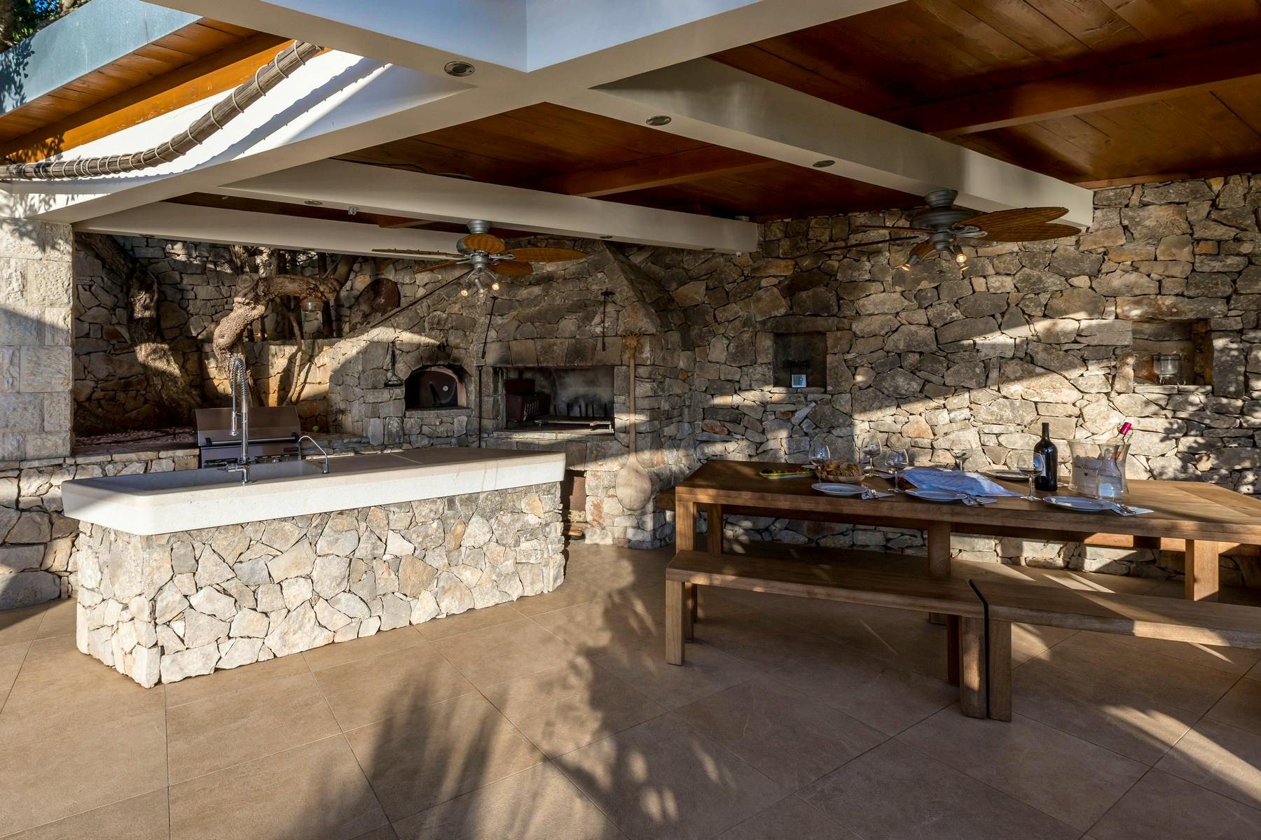 Summer kitchen with barbecue and dining area