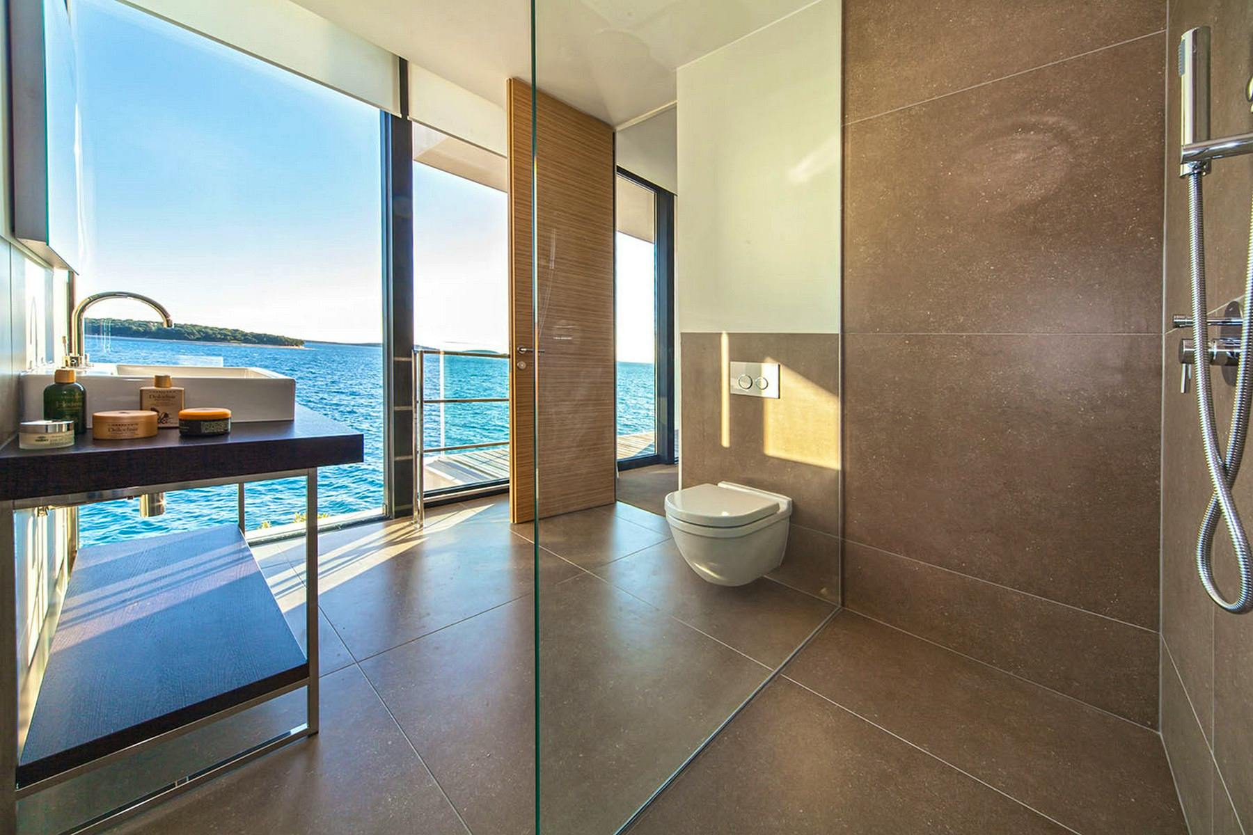 Spacious bathroom with open sea view