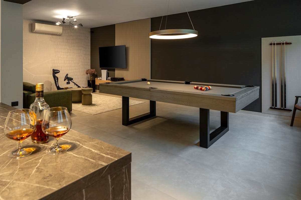 Entertainment area with a billiards table and a lounge zone.