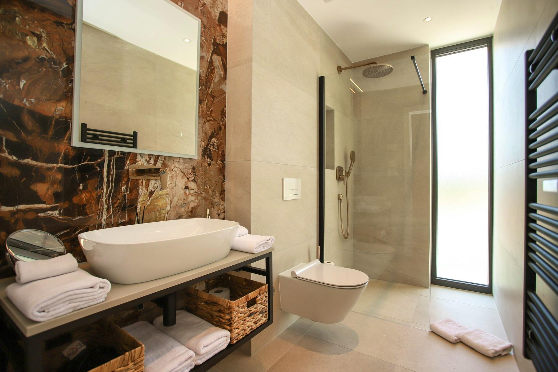 Spacious modern bathroom with walk-in shower