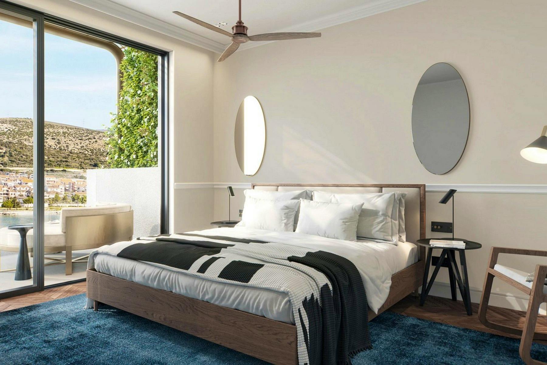 En-suite bedroom with balcony and sea view