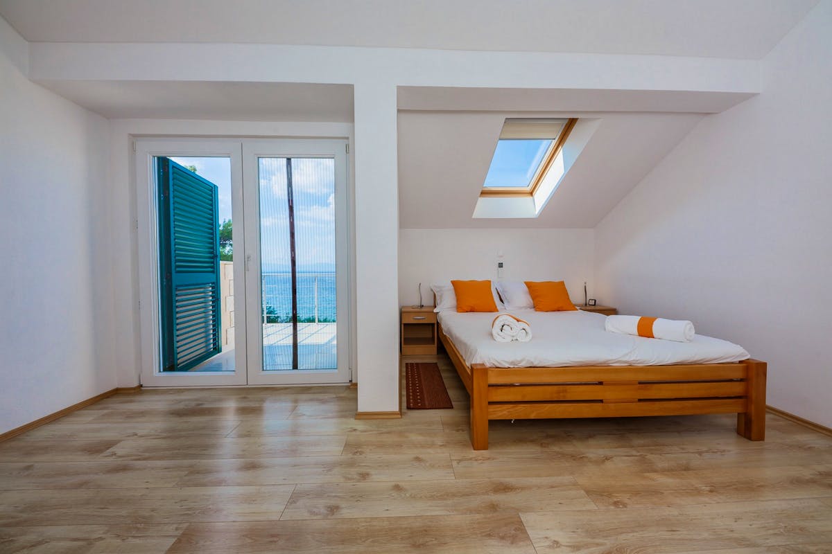 Master bedroom with balcony overlooking the sea