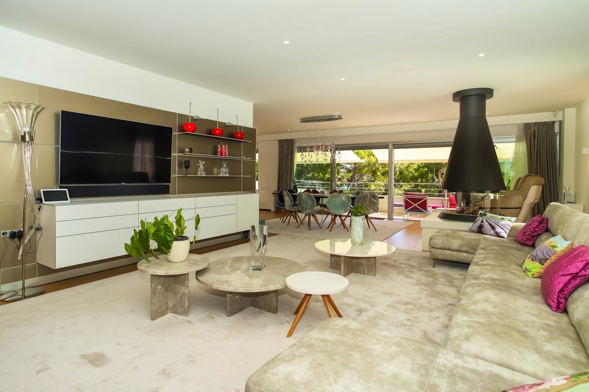Open space living area with fireplace and sea view