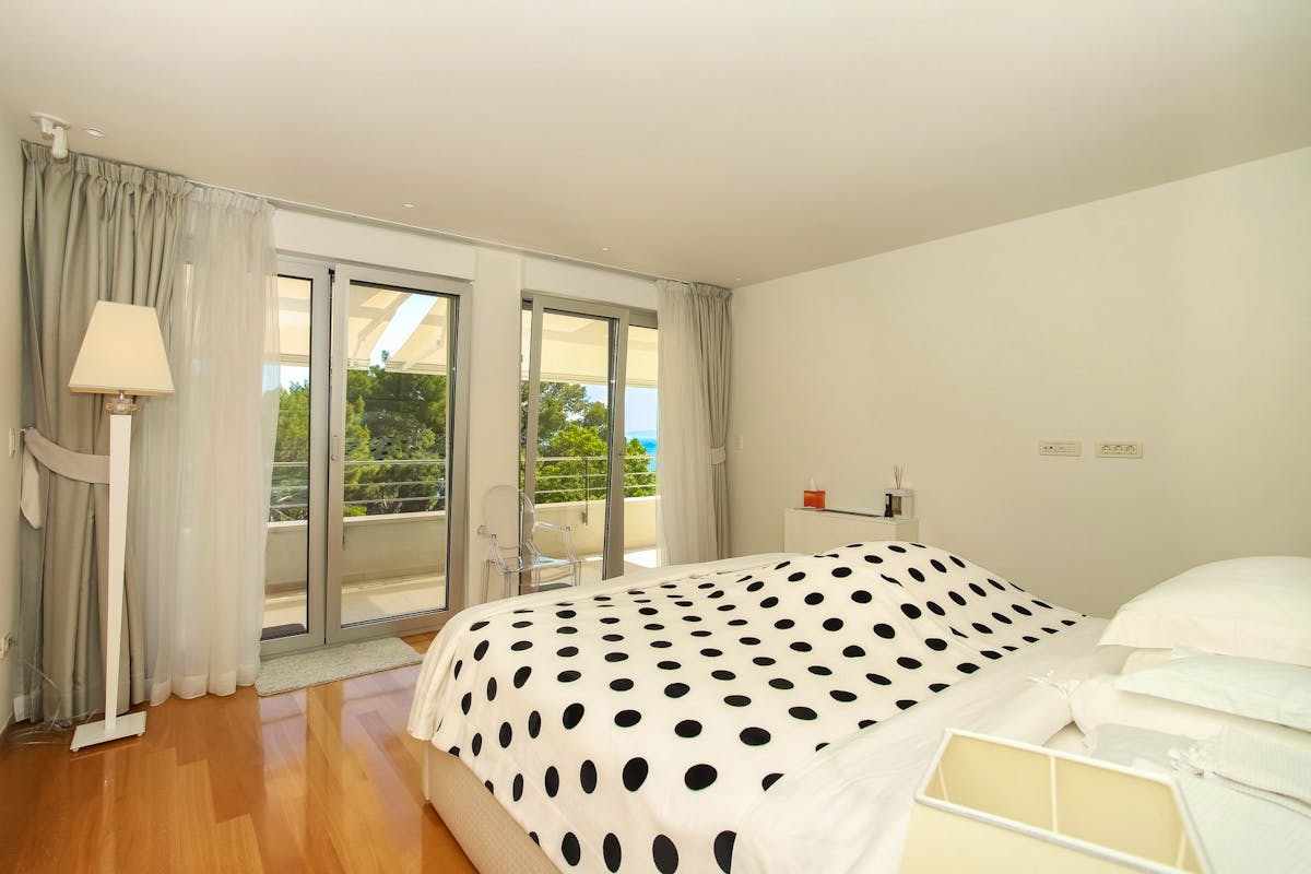 Master bedroom with balcony overlooking the sea