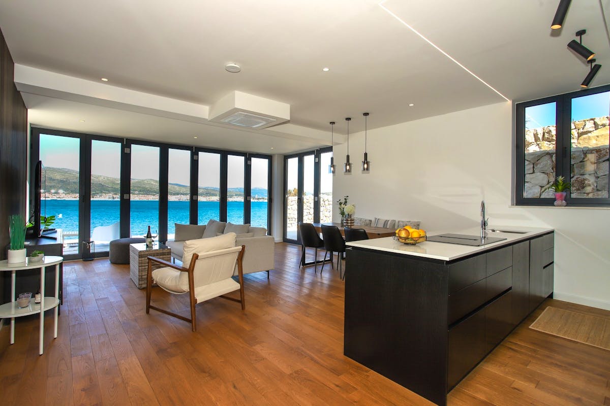 Open plan living space with kitchen, dining area and living room