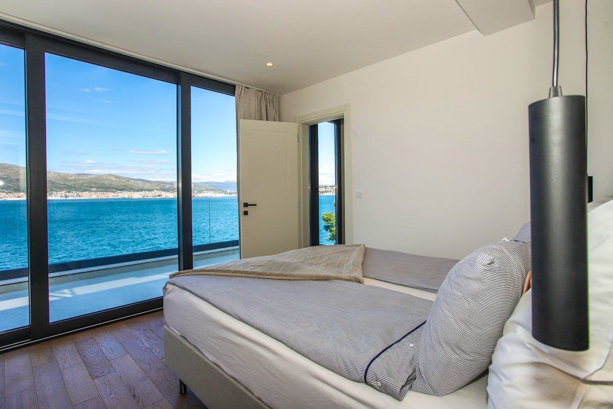 En-suite bedroom with open sea view