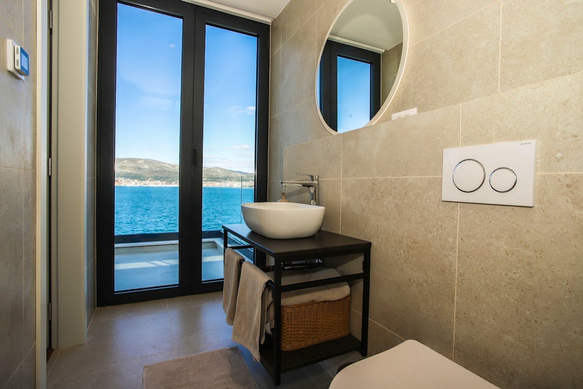 Spacious bathroom with open sea view