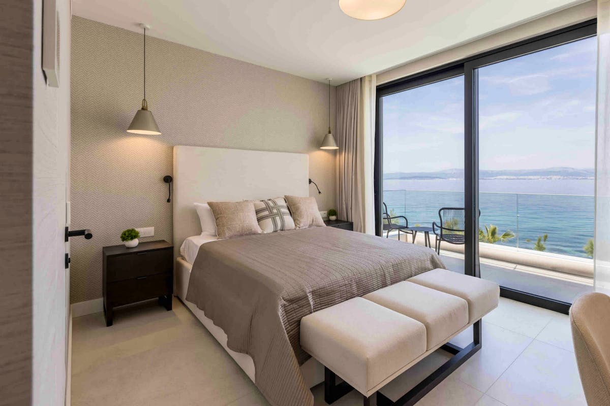 En-suite bedroom with open sea view