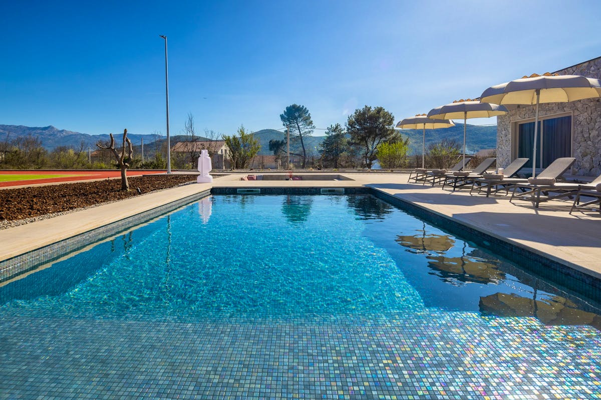 Spacious heated pool with sundeck