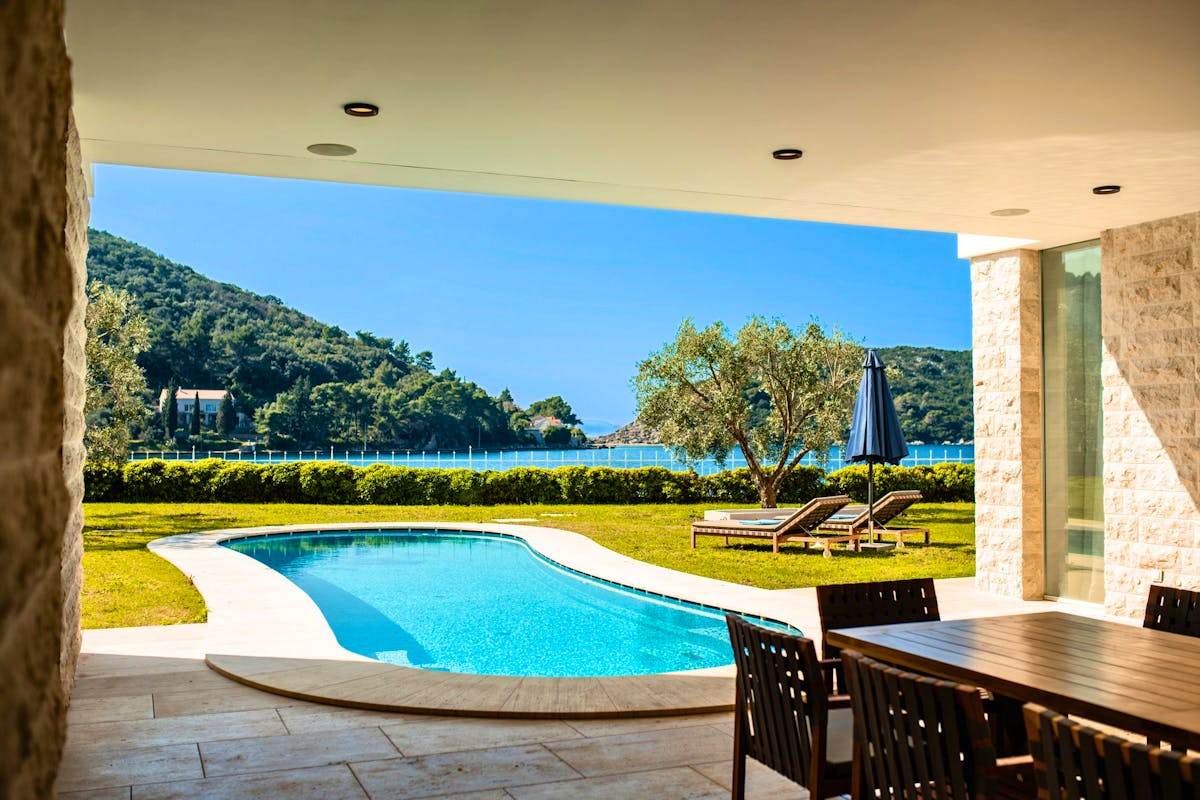 Spacious terrace with garden, pool and sea view