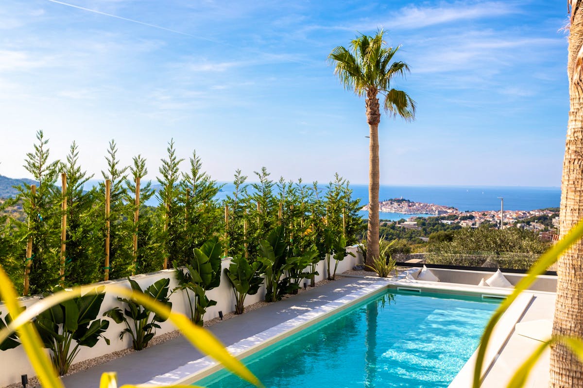 Swimming pool overlooking the sea and the old town of Primošten