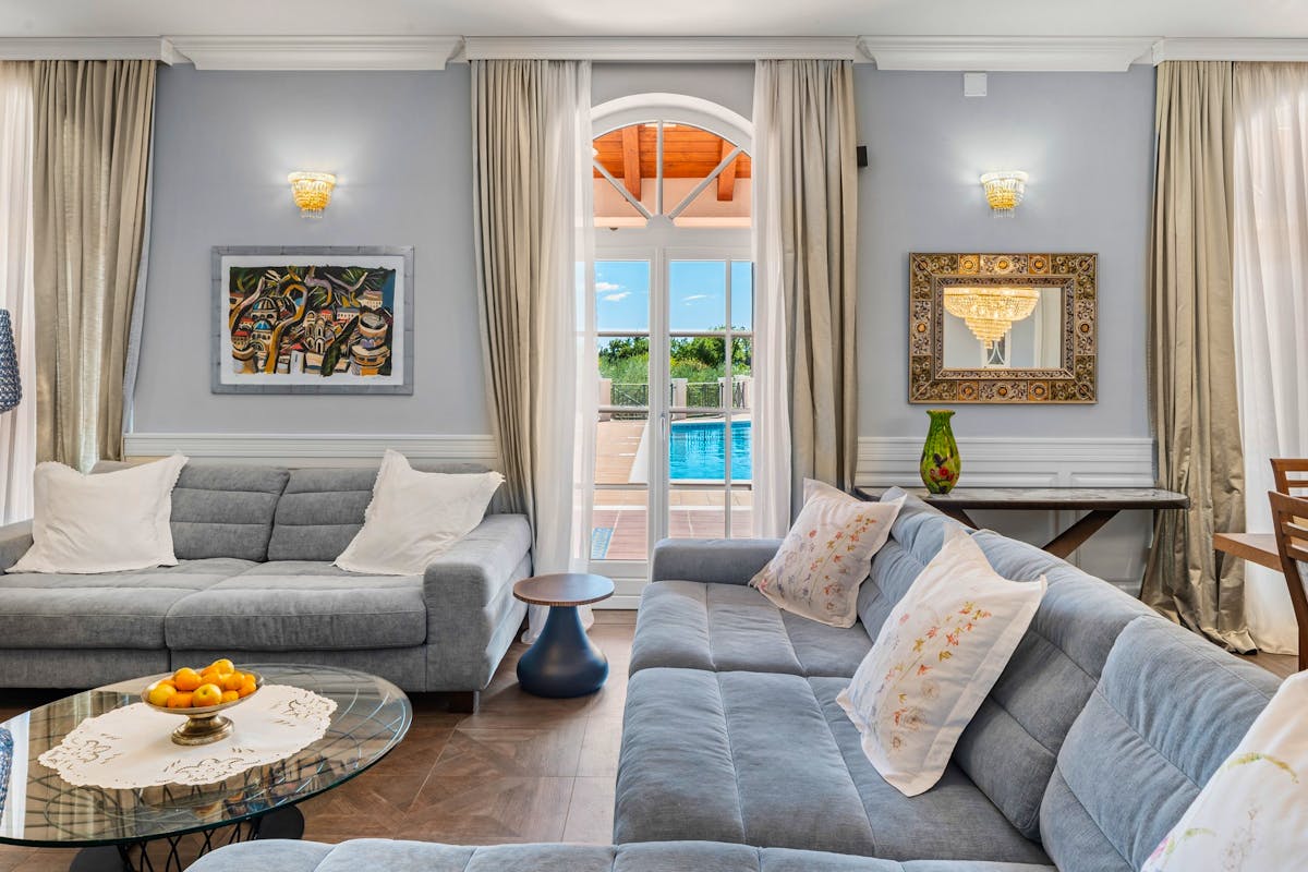 Stylish living room with access to the terrace with a swimming pool