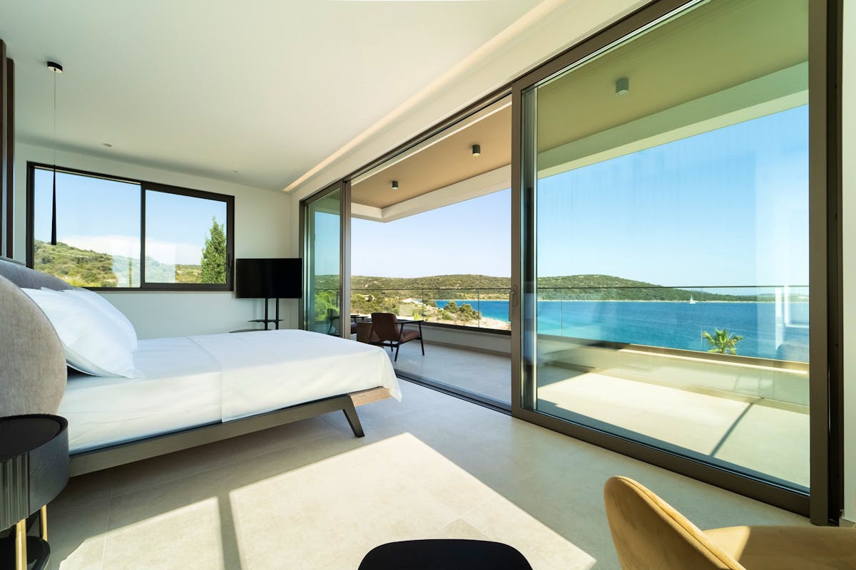 Master suite with balcony and open sea view